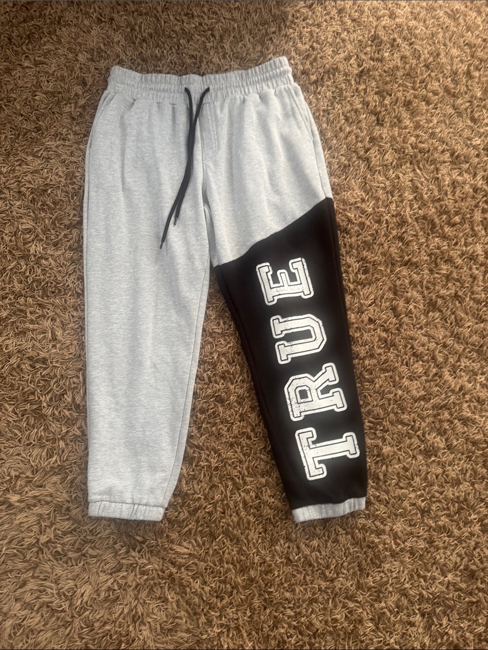 True Religion Gray and Black Two-Tone Men's Jogger Pants with 'TRUE' Leg Graphic